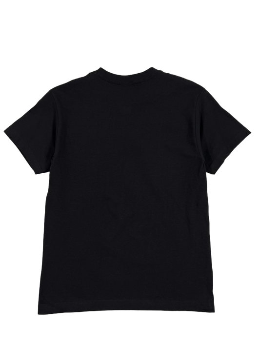 A PLEASURES black cotton t-shirt on a black background.
