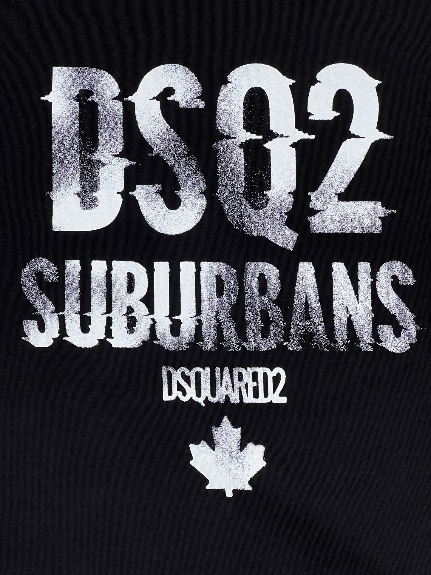 A 100% Cotton DSQUARED2 S74GD1219 Cool Fit T-shirt featuring a graphic print with the text "dsq2 suburbans" and the "Dsquared2" logo with a maple leaf below.