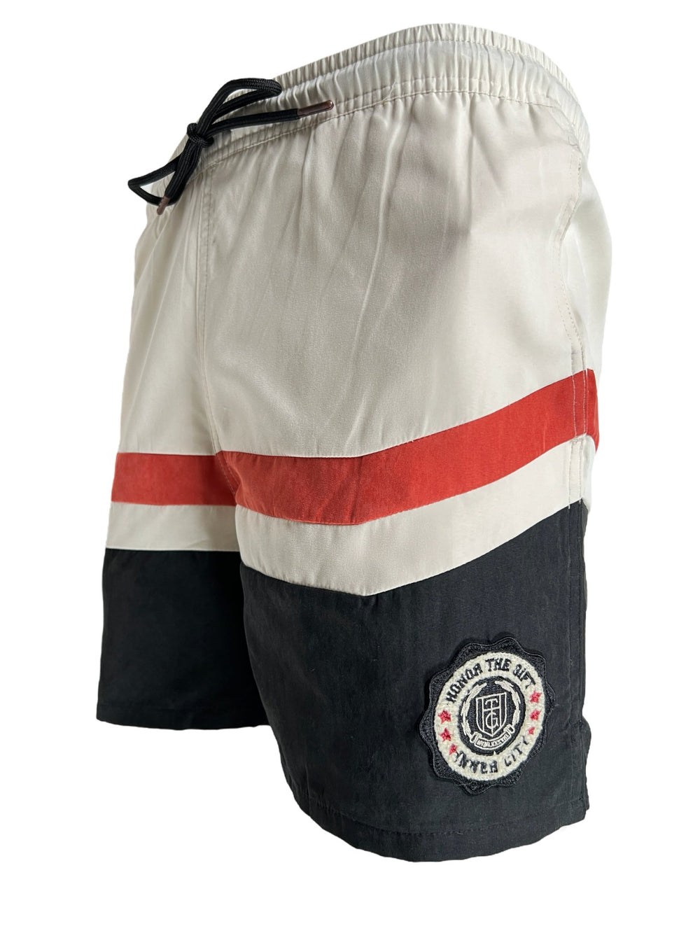 Athletic shorts with a colorblocked white, red, and black scheme, featuring an embroidered logo on the left leg from HONOR THE GIFT A-SPRING BRUSHED POLY TRACK SHORT BLACK.