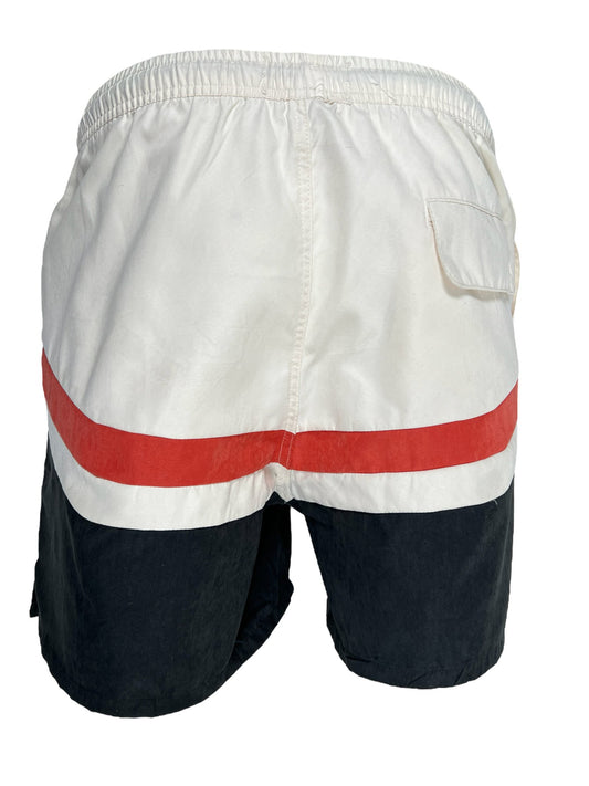 White and navy blue colorblocked HONOR THE GIFT A-SPRING BRUSHED POLY TRACK SHORT BLACK with a red horizontal stripe, featuring an elastic waistband and a pocket on the right side.