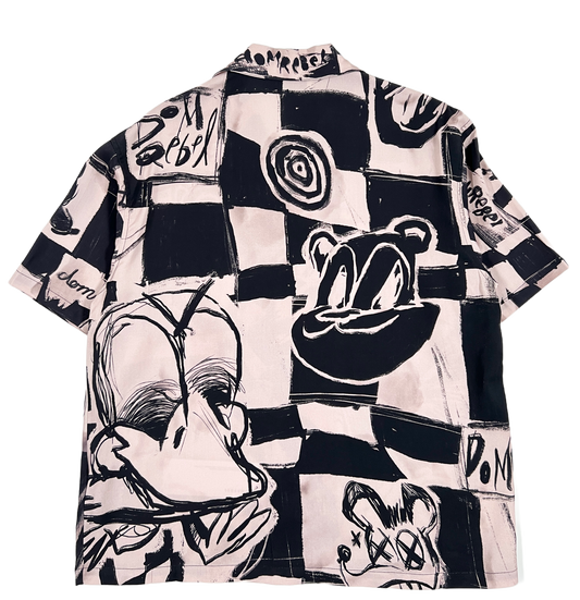 A black and white graphic short sleeve DOMREBEL CHECKMATE SHIRT PINK with cartoon characters on it by DOM REBEL.