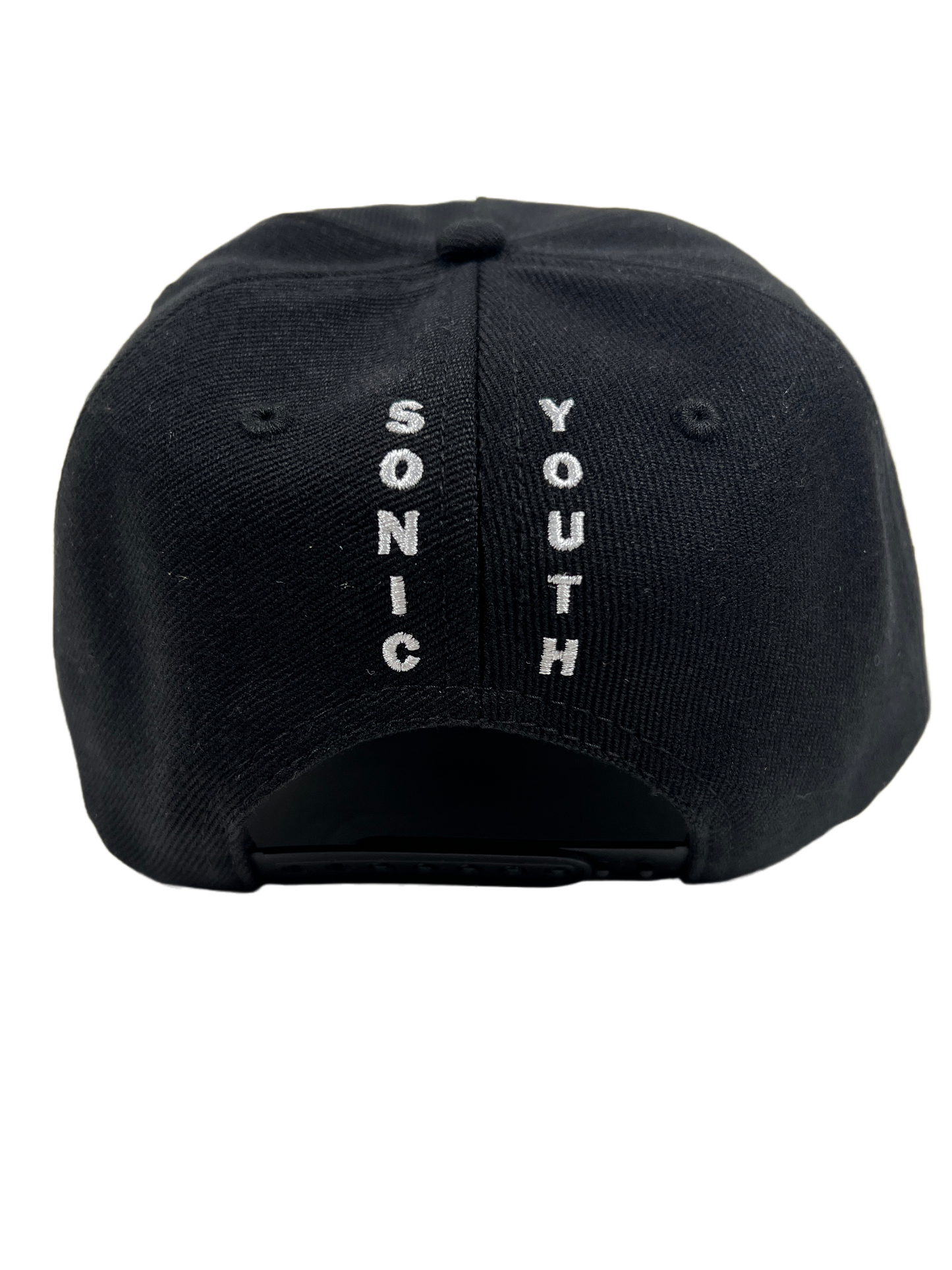 A black twill curved brim cap with the PLEASURES BUNNY SNAPBACK BLACK logo on it.