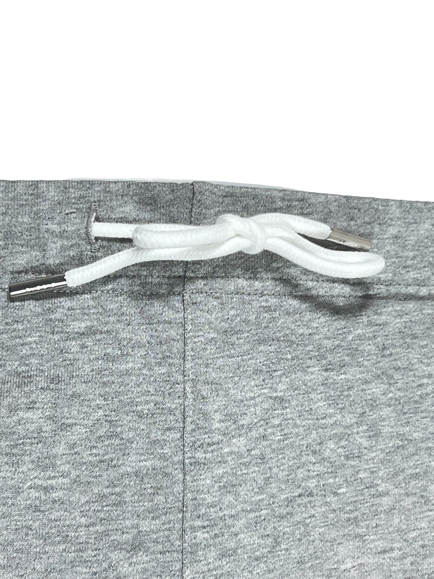 PURPLE BRAND P446-FWHG FRENCH TERRY SWEATSHORTS HEATHER white earphones tied in a knot on a gray 100% cotton sweat short fabric surface.