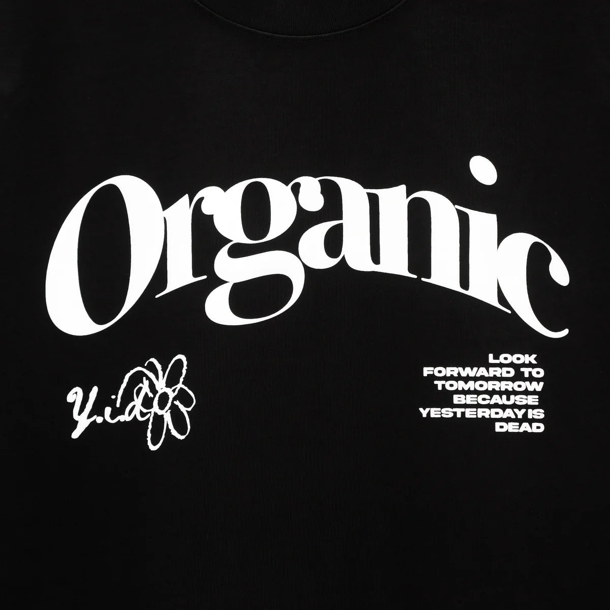 YESTERDAY IS DEAD Black 100% Cotton t-shirt with the word "organic" in large white letters, accompanied by a small graphic and the phrases "look forward to tomorrow because yesterday is dead" in white text.
