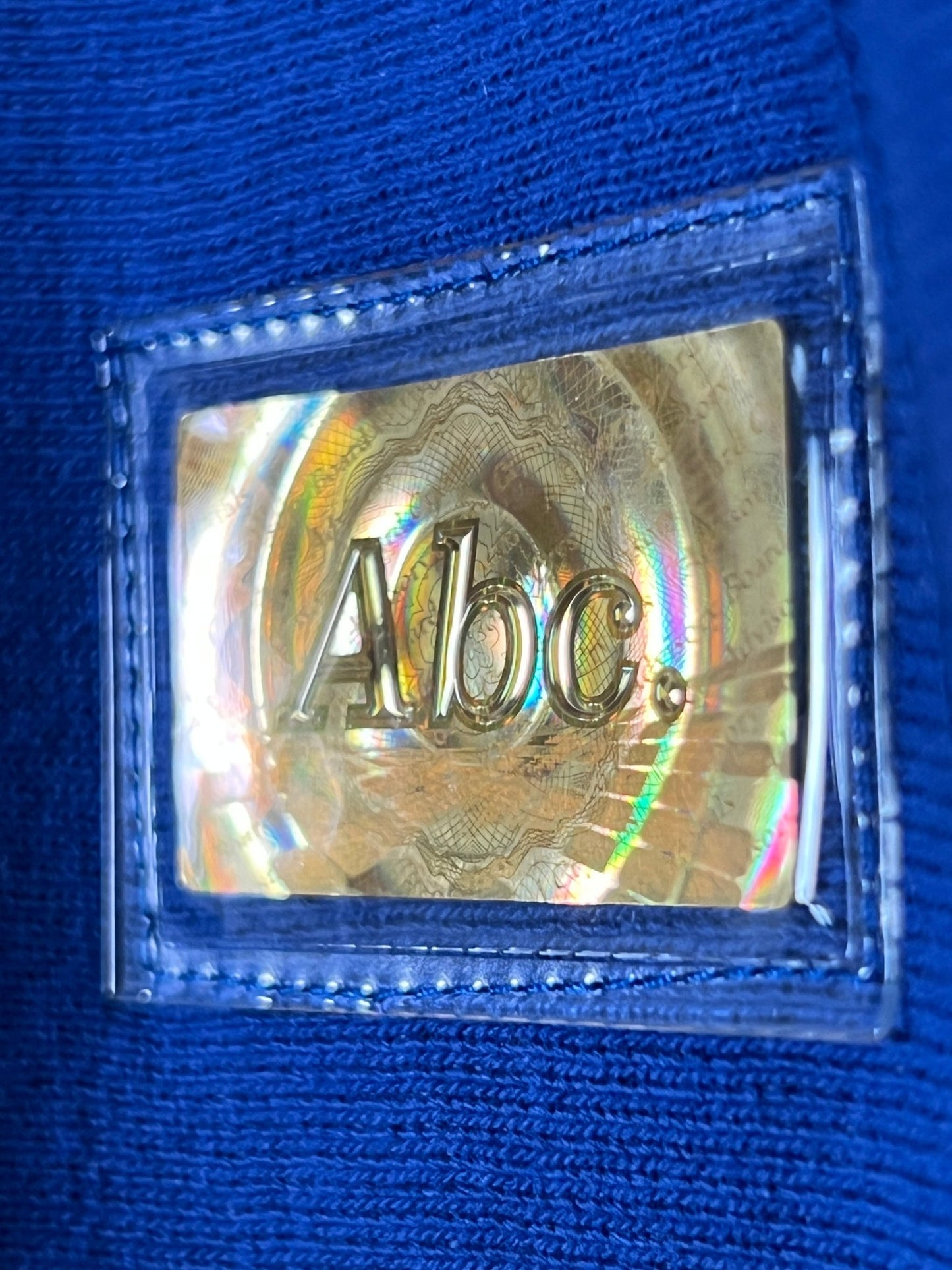 A close up of an ADVISORY BOARD CRYSTALS logo on a cotton hoodie in Los Angeles.
