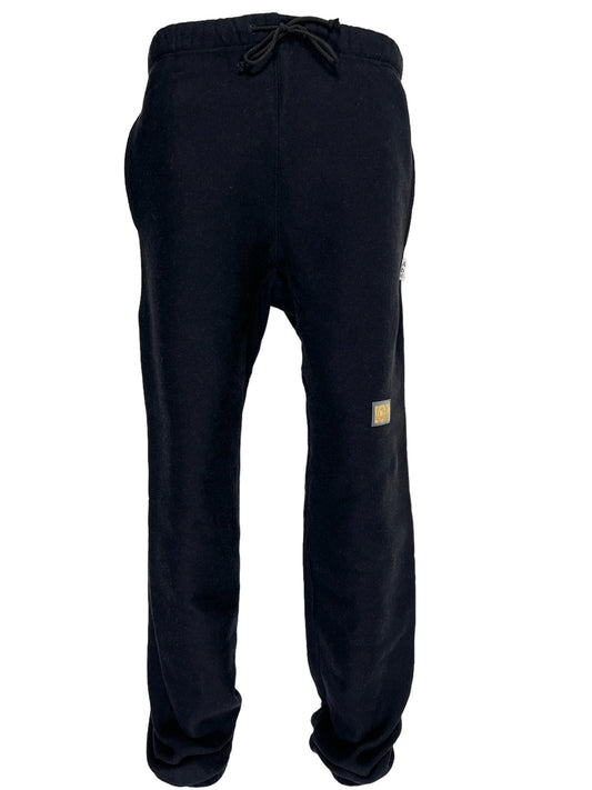 A black polyester Advisory Board Crystals sweatpants with a gold Los Angeles logo on the side.