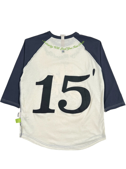 A ADVISORY BOARD CRYSTALS TEAM CONSCIOUSNESS BASEBALL TEE GREEN with the number 15 on it.