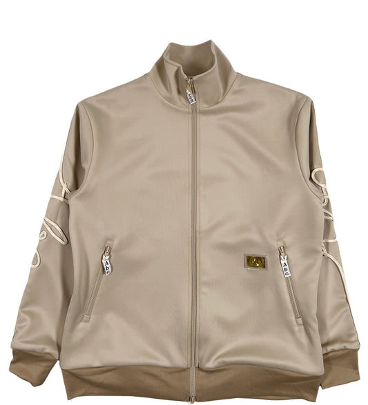 A ADVISORY BOARD CRYSTALS track jacket in feldspar ecru with gold lettering.