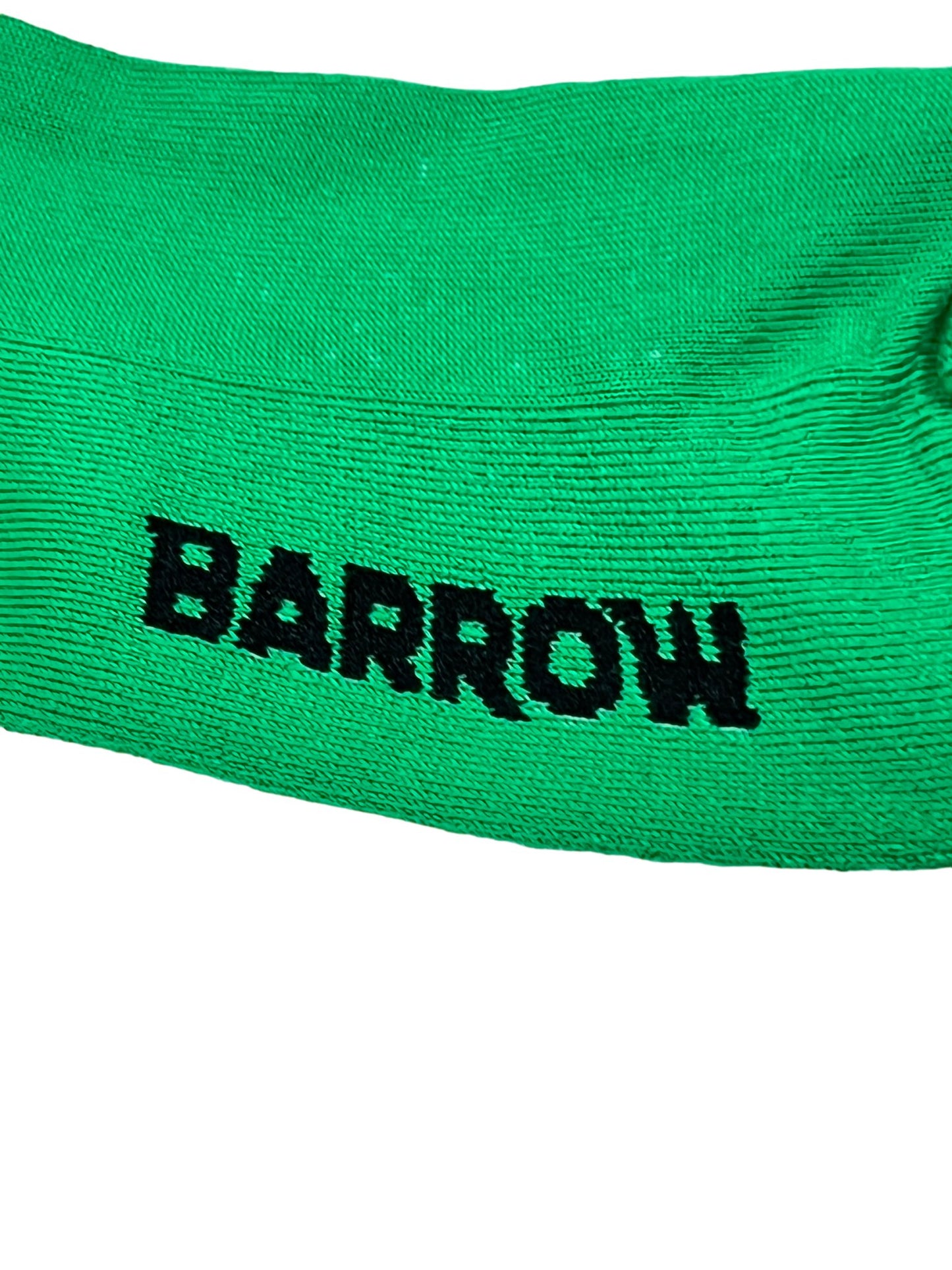 Close-up of green BARROW graphic socks with the word "BARROW" embroidered in black.