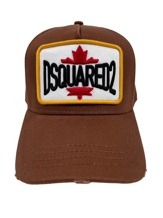 A brown DSQUARED2 BCM0611 BASEBALL CAP GABARDINE-NOCCIOLA embroidered with the word DSQUARED2 on it.