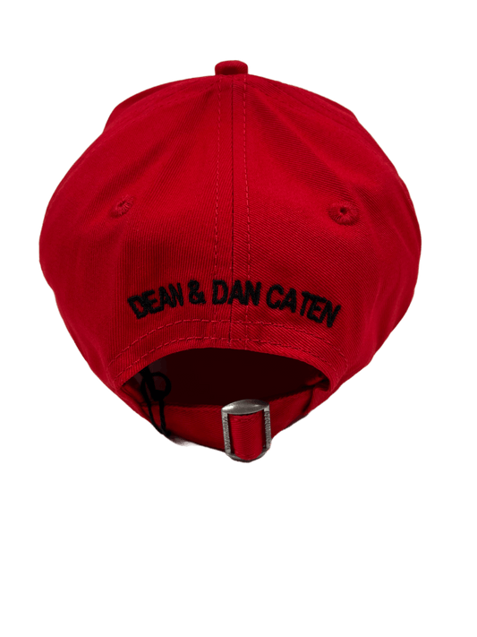 A red cotton hat with the words DSQUARED2 embroidered on it.