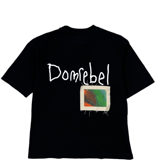 A DOMREBEL BORIS PATCH T-SHIRT BLACK with the word dombel on it, requiring a gentle wash.