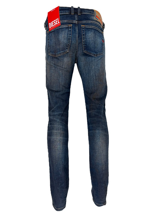 A pair of Diesel skinny style jeans with a red tag on the back.