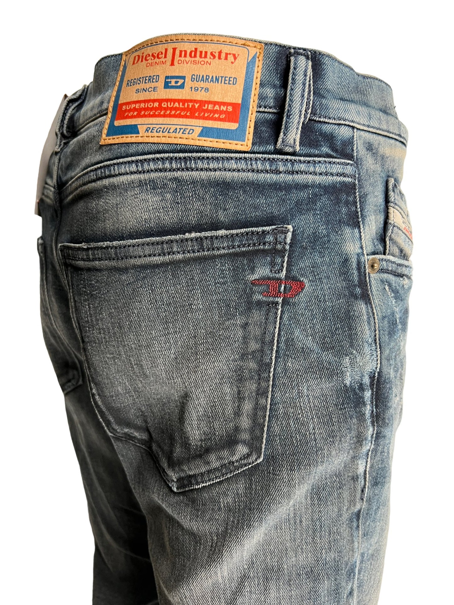 A pair of comfortable Diesel jeans with a label on the back.