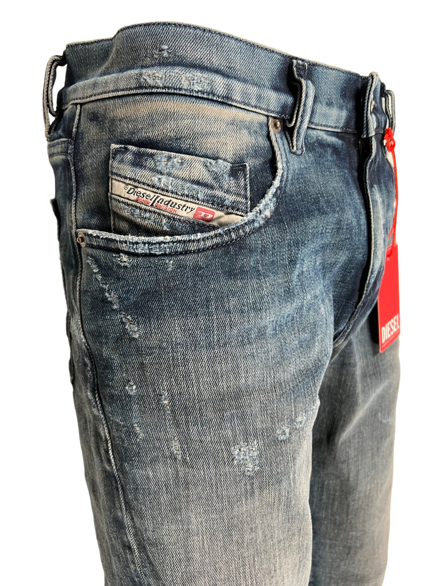 A comfortable pair of DIESEL JEANS 2019 D-STRUKT 9H54 with a tag on the pocket.