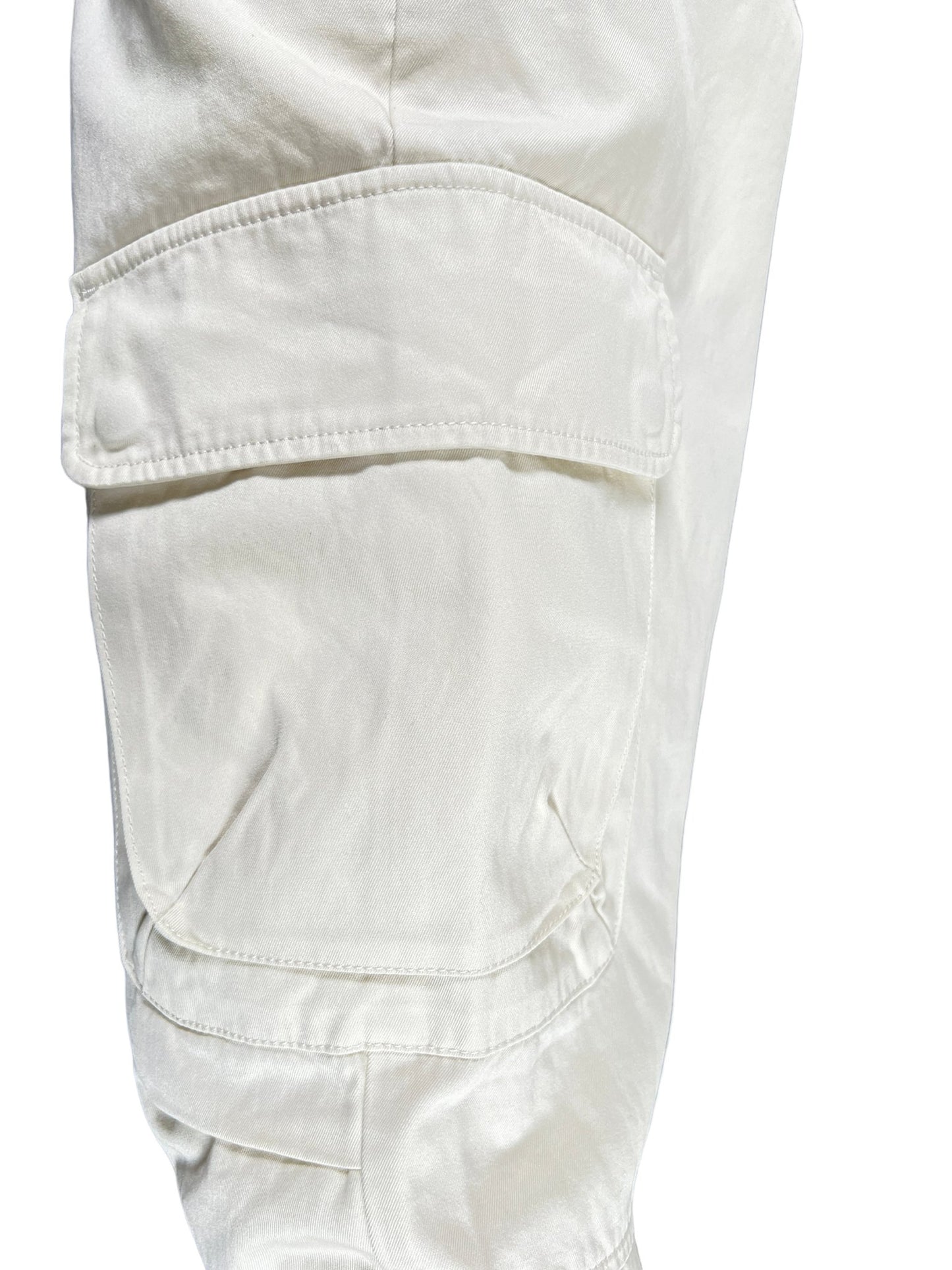 A pair of white Diesel P-Argym cargo pants with cargo pockets on a white background.