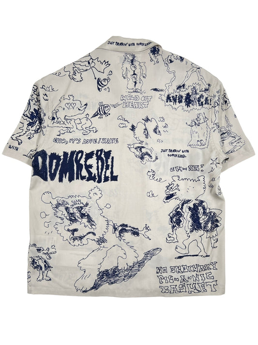 A white short sleeve shirt with DOMREBEL BEARING CAMP COLLAR SHIRT BEIGE drawings printed all over it.