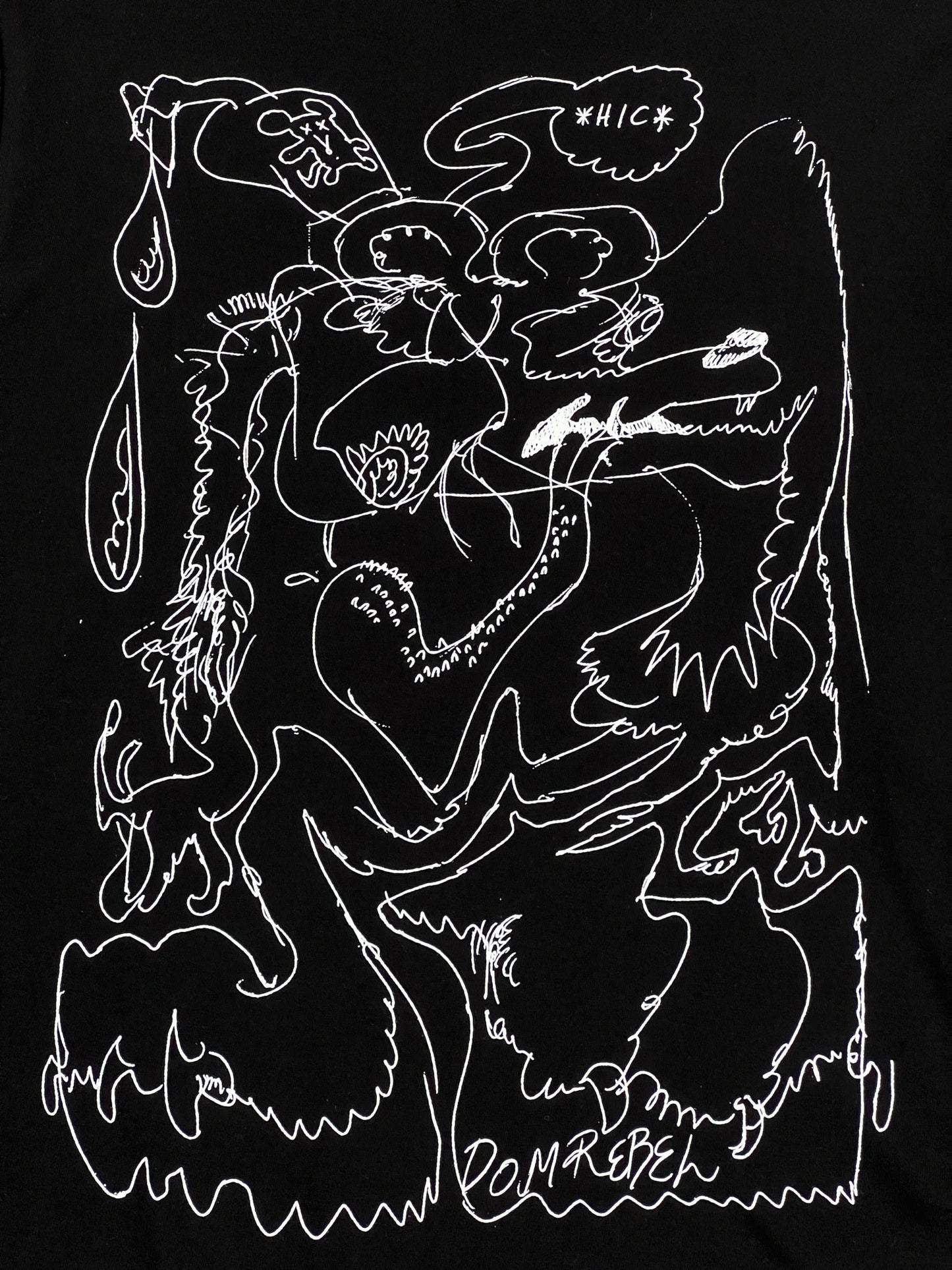 A black DOM REBEL long sleeve t-shirt with a drawing on it.