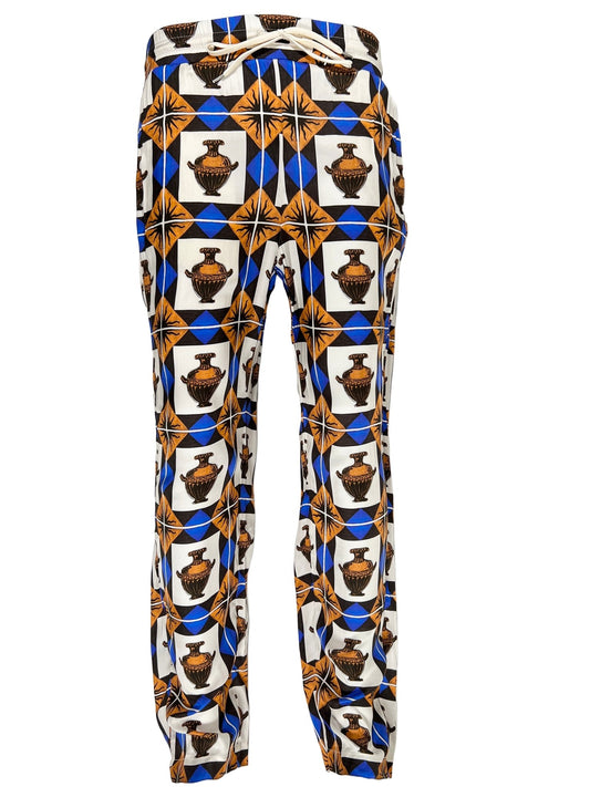 A pair of DROLE DE MONSIEUR PANT BP122-VI002-BN VASE BROWN pants with an African print on them.