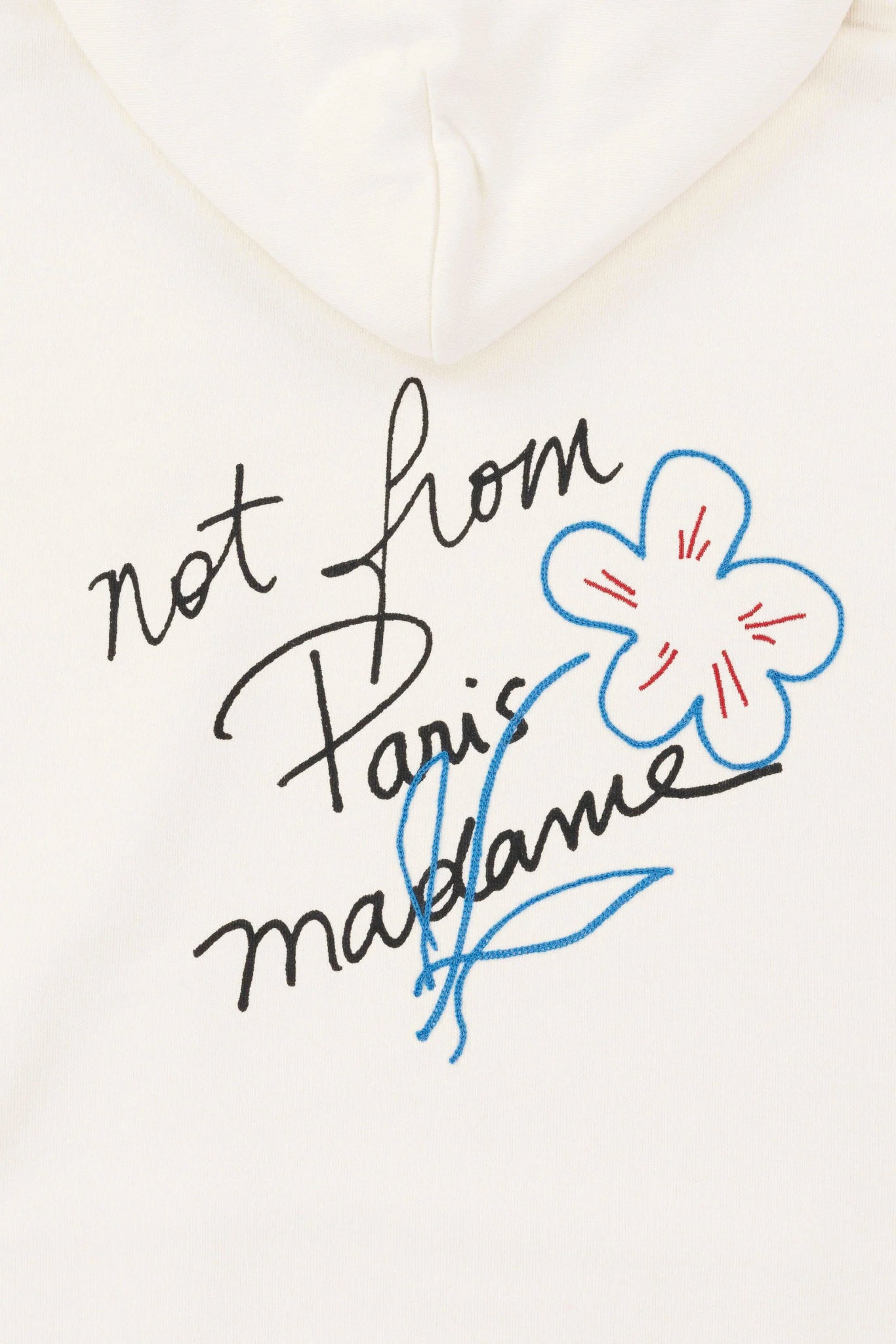 A white cotton DROLE DE MONSIEUR D-HO150-CO127-CM Le Hoodie Slogan Cream with the embroidered slogan "not from paris madeleine" on it.