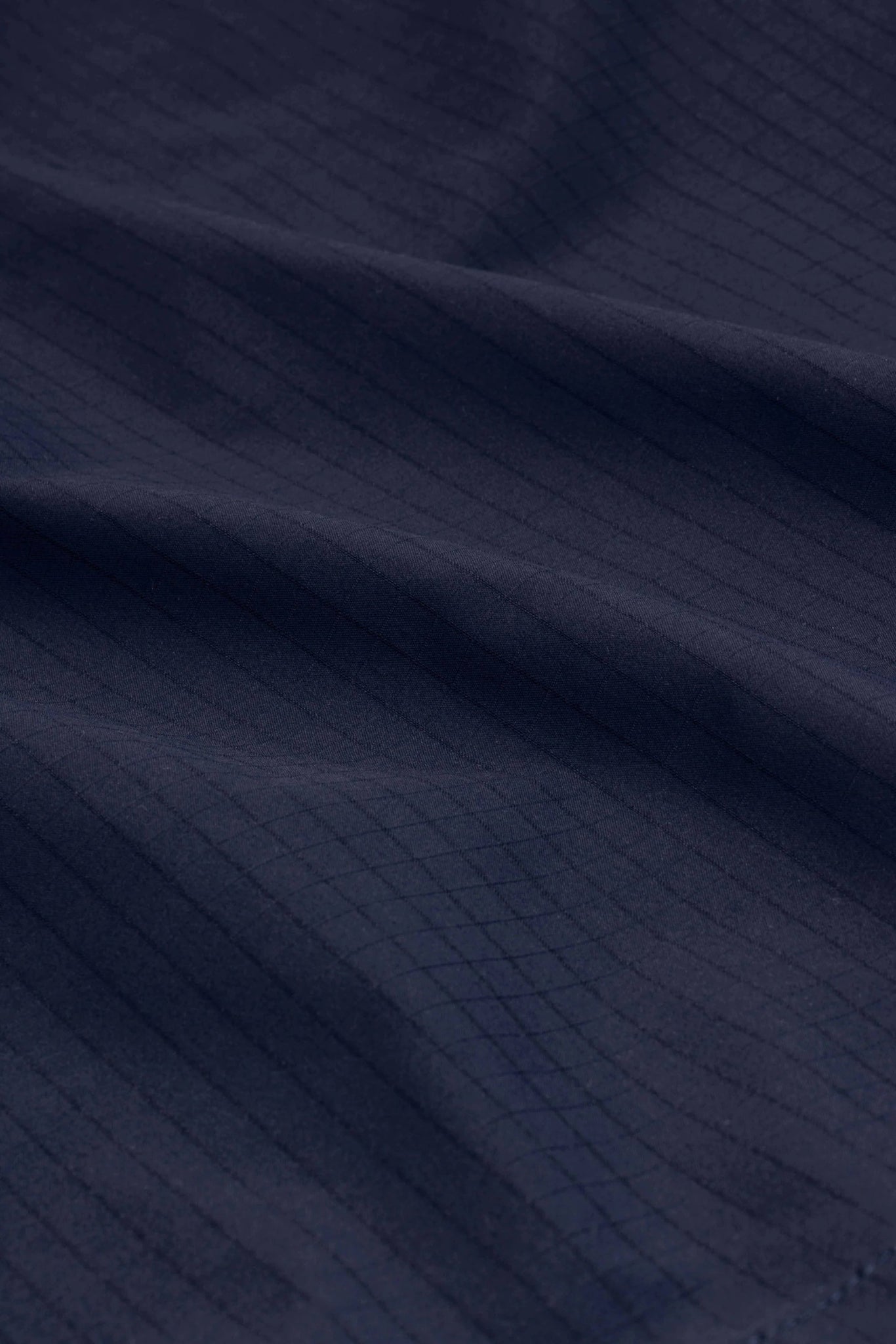 A close up image of a DROLE DE MONSIEUR JACKET D-JT178-PL131 LA VESTE SLOGAN ESQUISSE NY, water-repellent fabric.