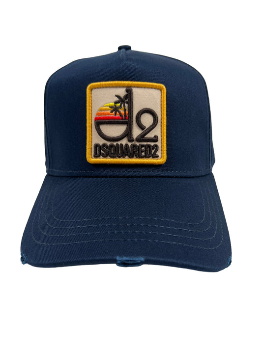 A navy blue DSQUARED2 BCM0802 Tropical Baseball Cap Gabardine with a palm tree patch on it.