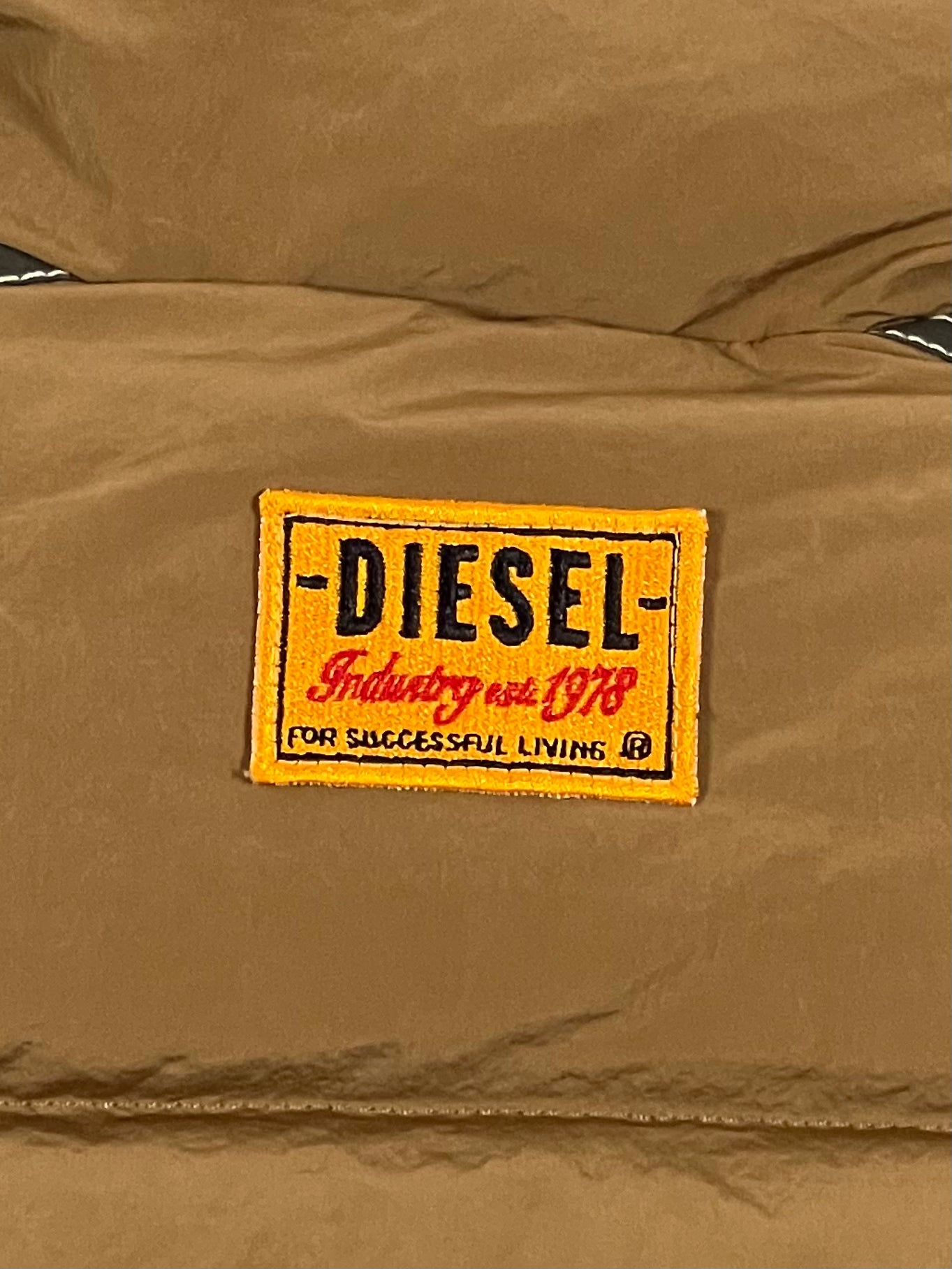 A tan, water-repellent DIESEL W-ERIC JACKET SPONGE with a Diesel logo on it.