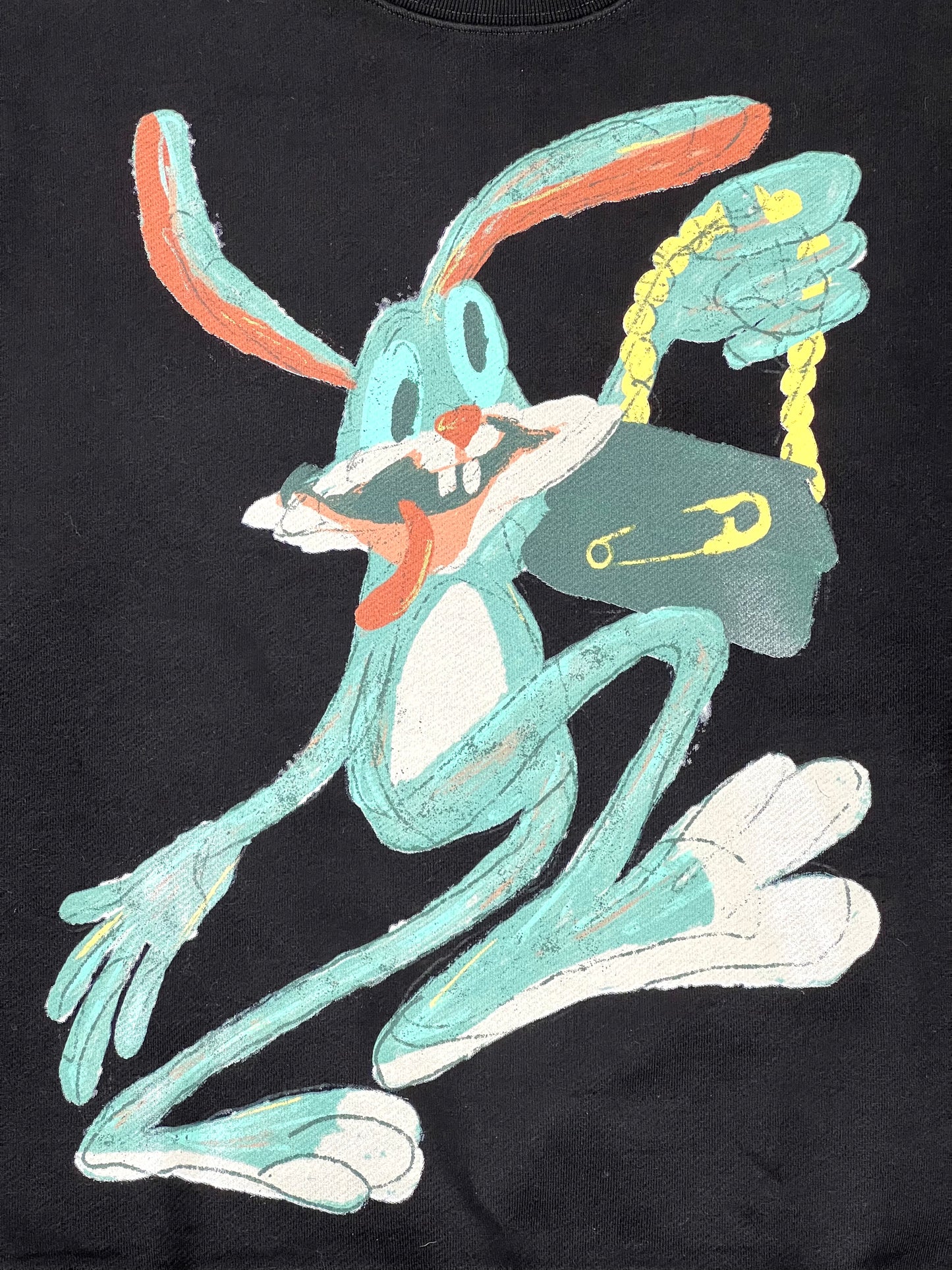 A DOMREBEL SHOPPER SWEATSHIRT BLACK with an image of a rabbit holding a purse.