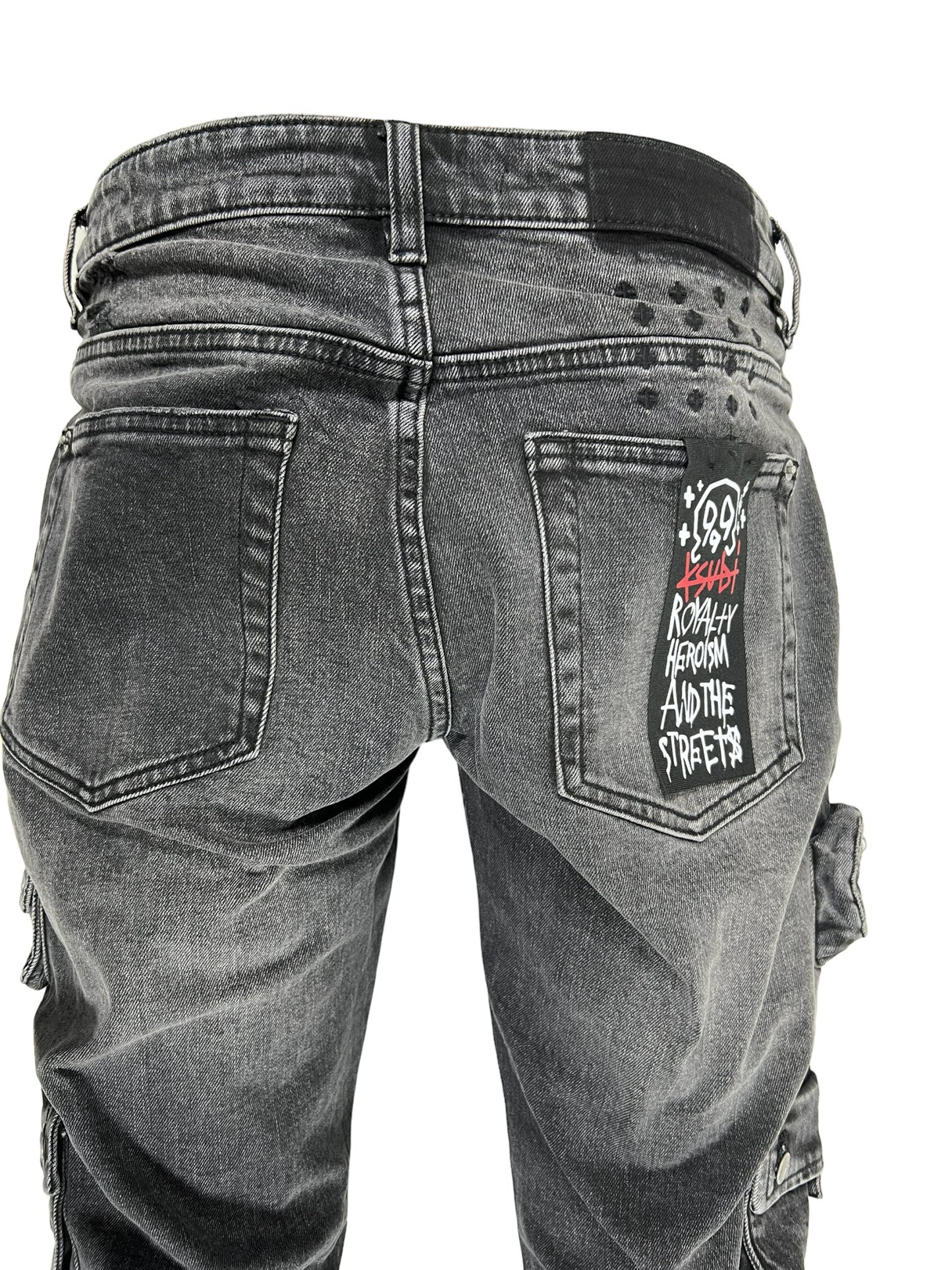 The back view of a pair of men's Ksubi 999 Bronko Cargo jeans featuring embroidery branding.