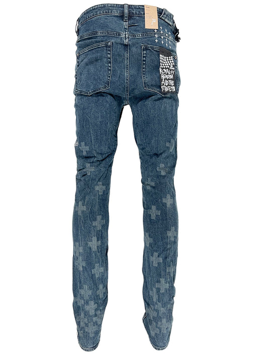 The back of a pair of KSUBI CHITCH NIGHT SWIM DENIM jeans with a cross on them.
