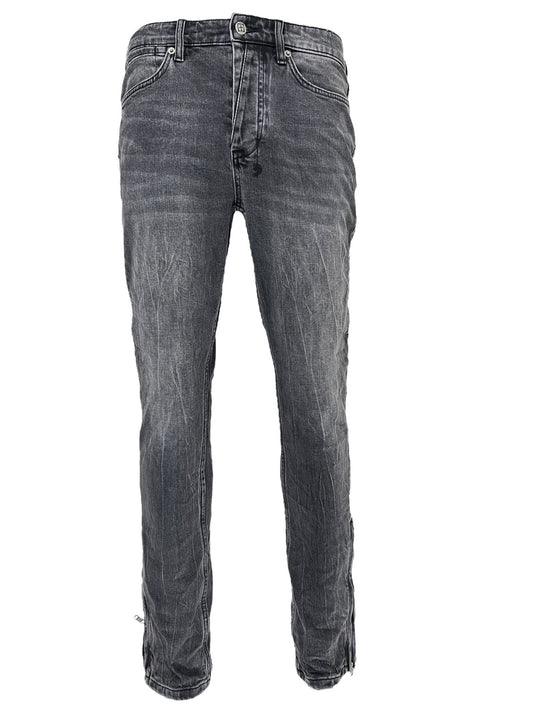 A pair of KSUBI VAN WINKLE CHAMBER BLACK men's skinny jeans on a white background.