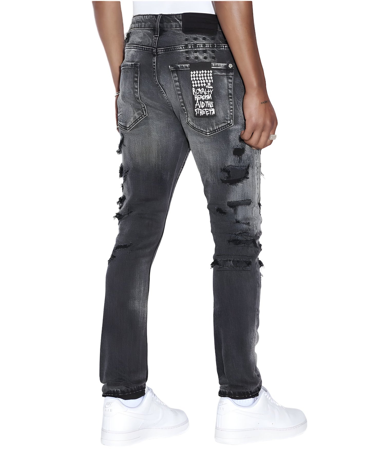 The back view of a man wearing ripped Ksubi Van Winkle Tektonik Black jeans.