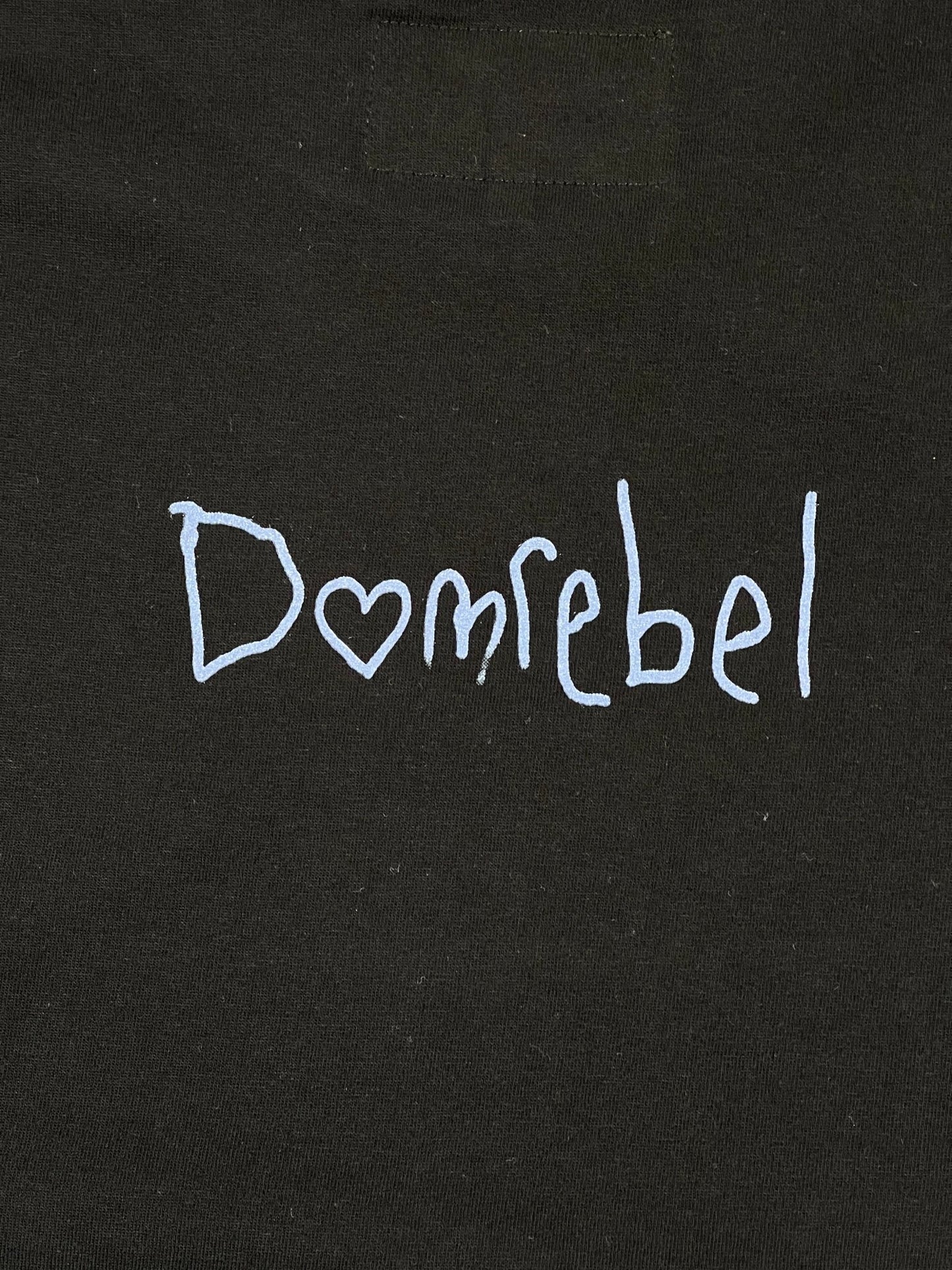 A DOMREBEL NOOKIE T-SHIRT BLACK with the word DOM REBEL written on it.