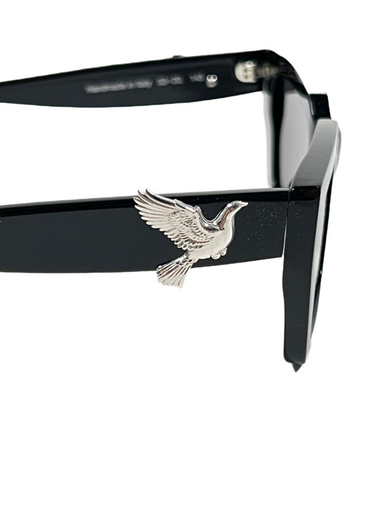 A pair of 3.PARADIS sunglasses with a bird on them.