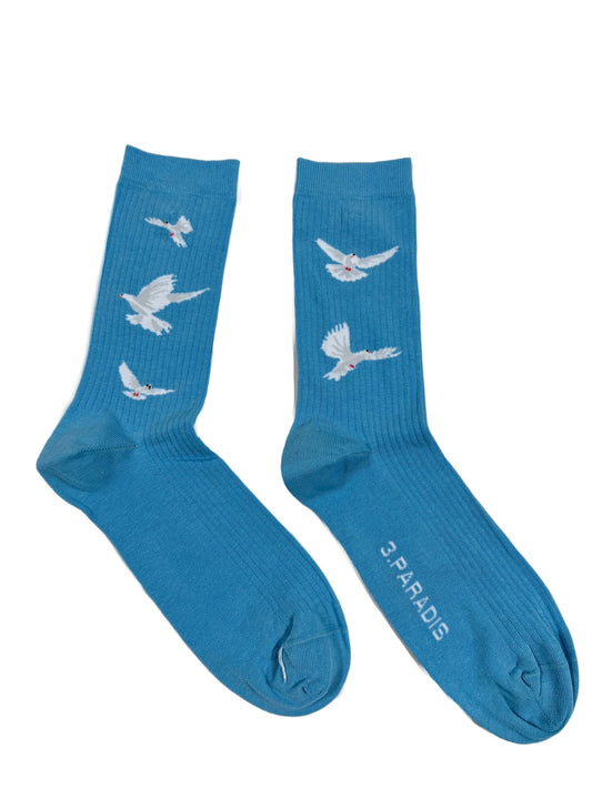 A pair of 3.PARADIS sky blue socks with white birds on them.