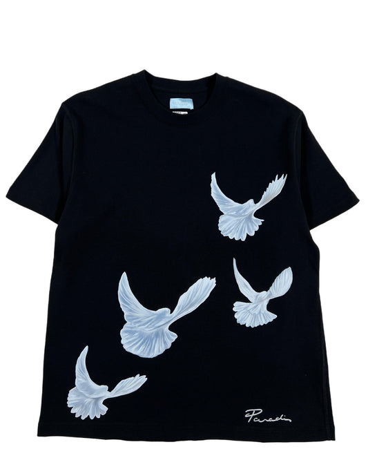 A 3.PARADIS SINGING DOVES BLACK T-SHIRT with white doves on it.