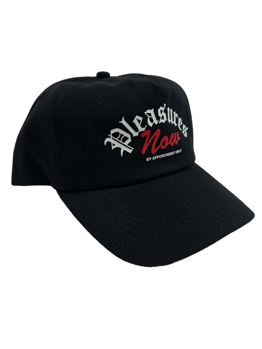 A black PLEASURES APPOINTMENT UNCONSTRUCTED SNAPBACK BLK with a red logo on it.