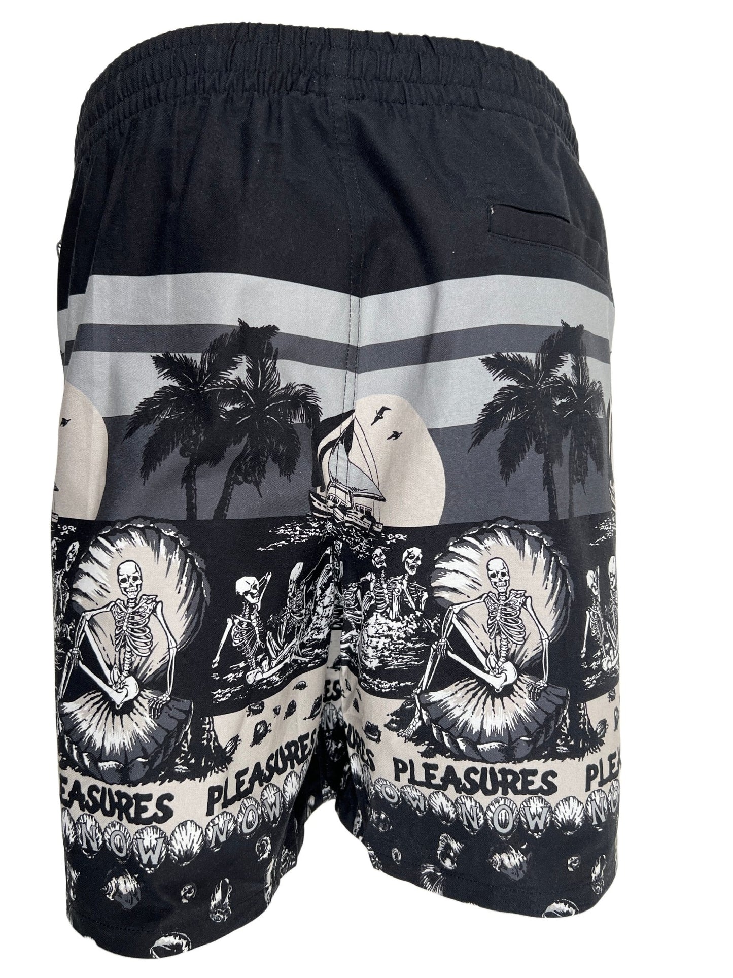 A black cotton swim trunk with palm trees and palm trees on it, featuring a relaxed fit, like the PLEASURES BEACH SHORT BLACK by PLEASURES.