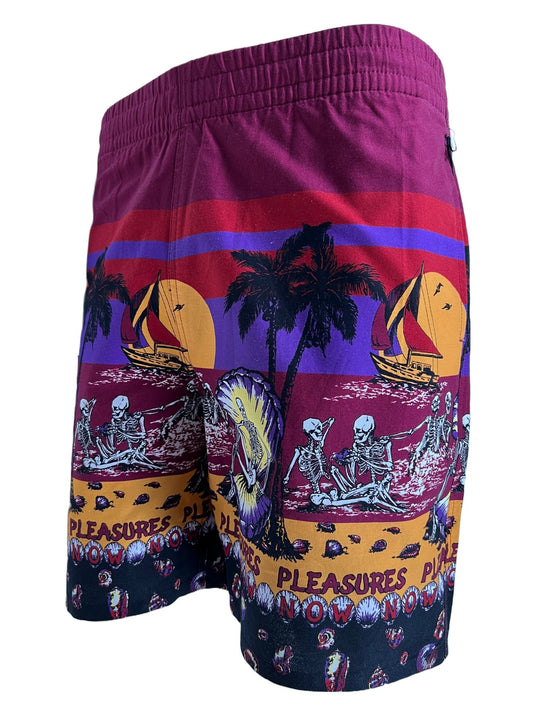A men's swim shorts with palm tree print and PLEASURES design, the PLEASURES BEACH SHORT BURGUNDY.