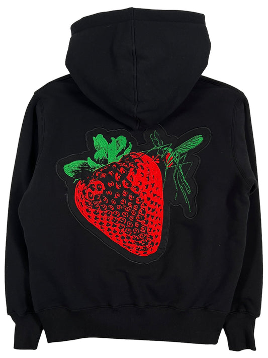 A PLEASURES black hoodie with a strawberry embroidery on it.