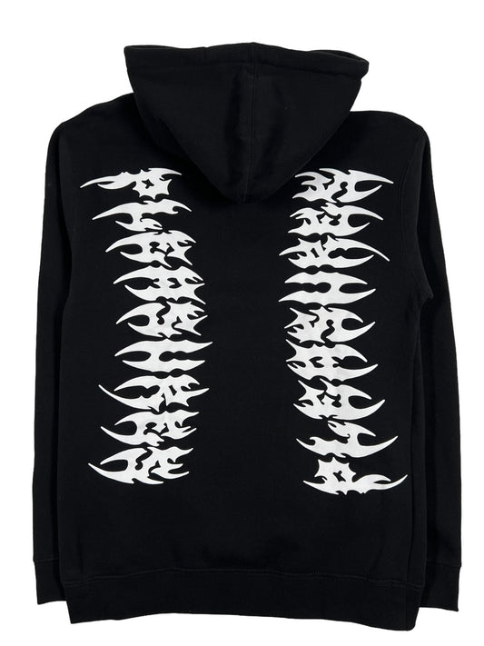 A black PLEASURES RIPPED HOODIE BLACK with white flames on it, offering unmatched comfort.