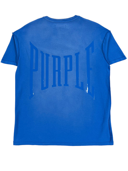 A PURPLE BRAND P101-JUCB TEXTURED INSIDE OUT TEE BLUE with the word "purple" on it.