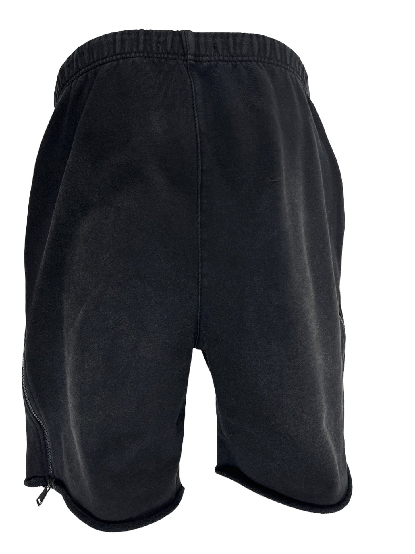 A pair of PURPLE BRAND P479-MFBW MWT FLEECE SWEATSHORT BLACK with an elastic waistband and visible stitching, shown from the back, crafted by PURPLE BRAND.