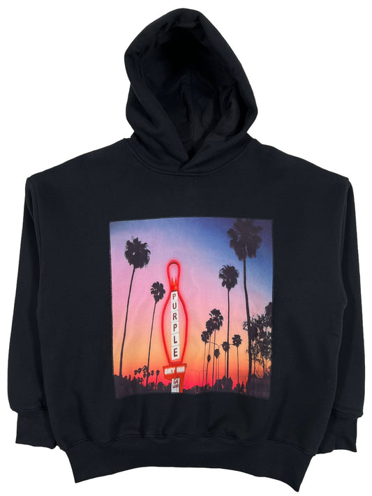 A PURPLE BRAND P494-PBCS PURPLE X BLUE SKY HOODY BLACK featuring an image of palm trees at sunset.