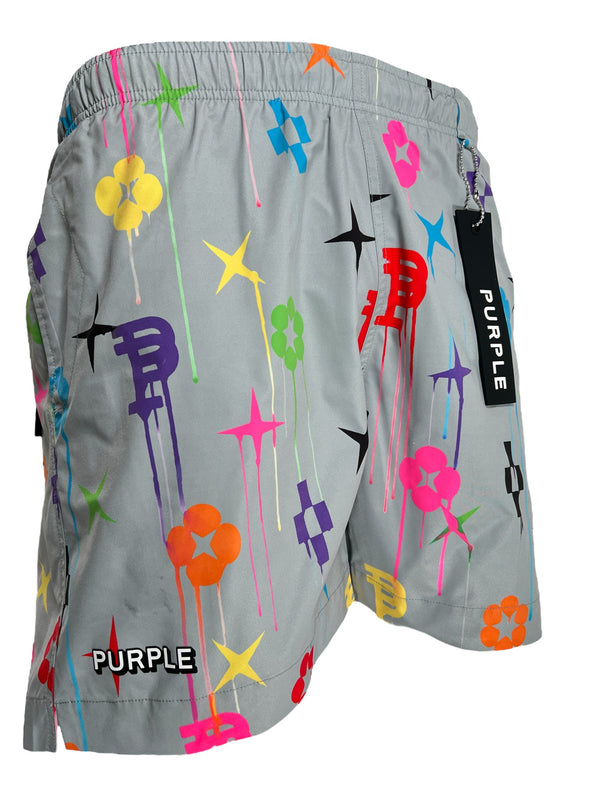 Gray shorts with a vibrant graffiti pattern featuring stars, flowers, and abstract shapes. The word "PURPLE" is visible on the tag and embroidered on the shorts. This unique design enhances the appeal of these stylish PURPLE BRAND P504-PGPM ALL ROUND SHORT AOP swim trunks by PURPLE BRAND.