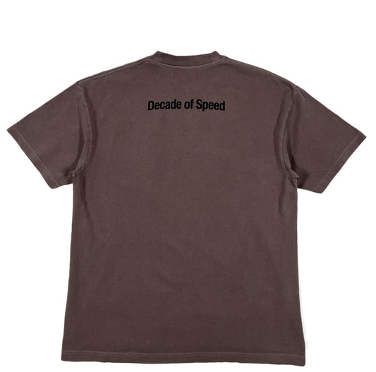 A REPRESENT brown graphic t-shirt with the words 'decade of speed' on it.