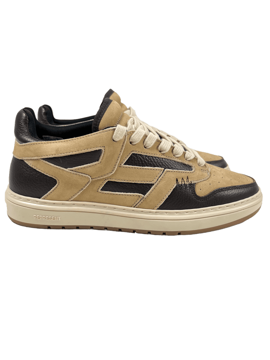 A pair of REPRESENT sneakers in beige and black leather.