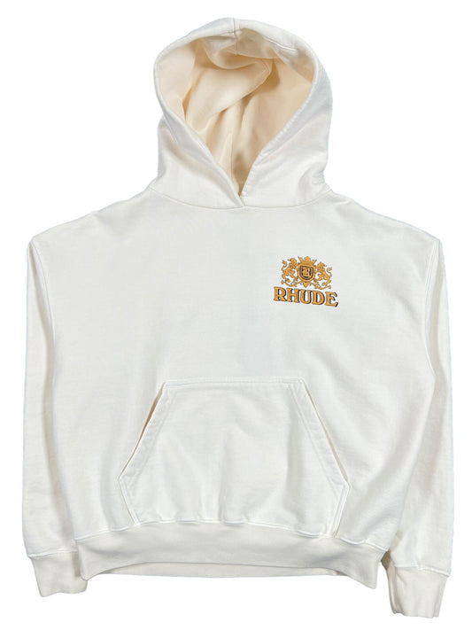 A white Rhude Cresta Cigar hoodie with a gold logo on it.