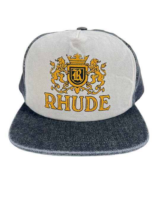 A minimalist RHUDE CRESTA DENIM HAT BLACK/CREAM with the word RHUDE on it.