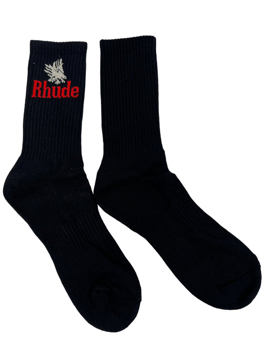 A pair of black polyester RHUDE EAGLES socks with the word riddle on them.